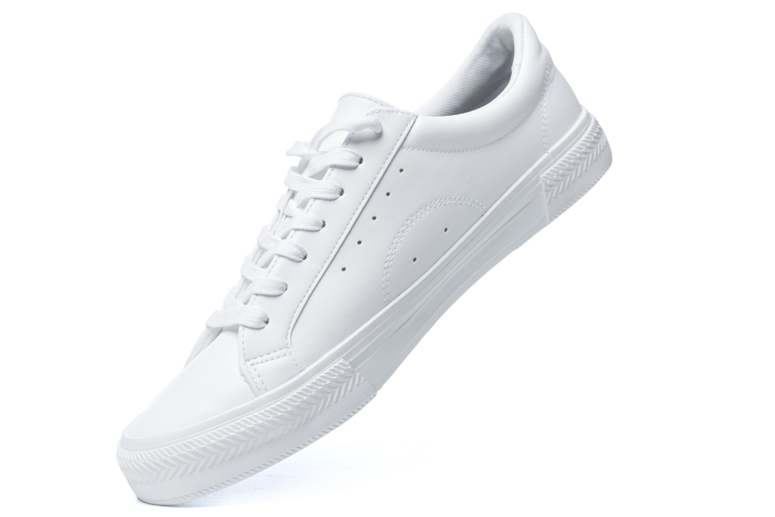 Trainers – white leather shoe on white background