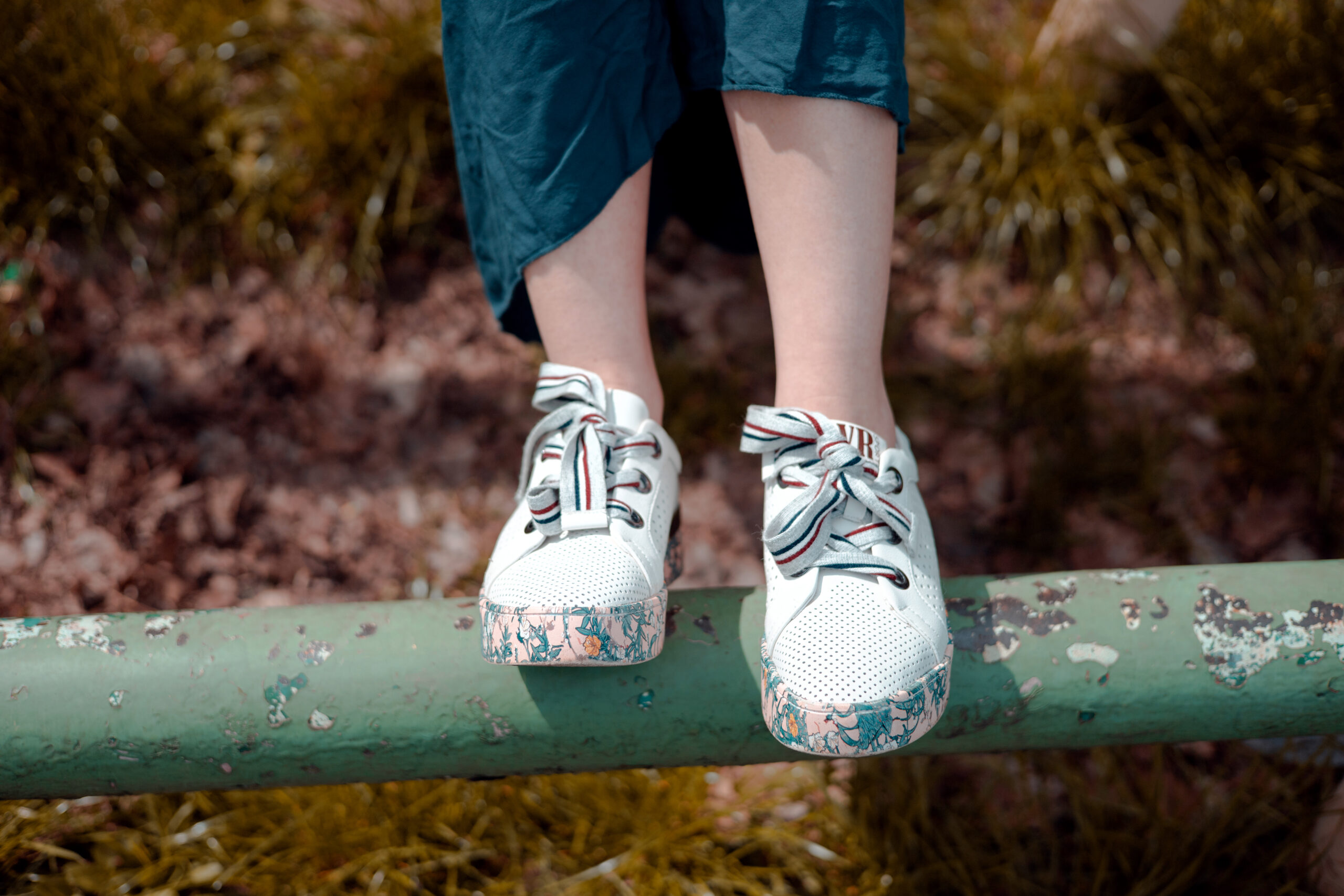 shoes-on-a-background-of-playground-with-copy-spac-2023-11-27-04-57-54-utc