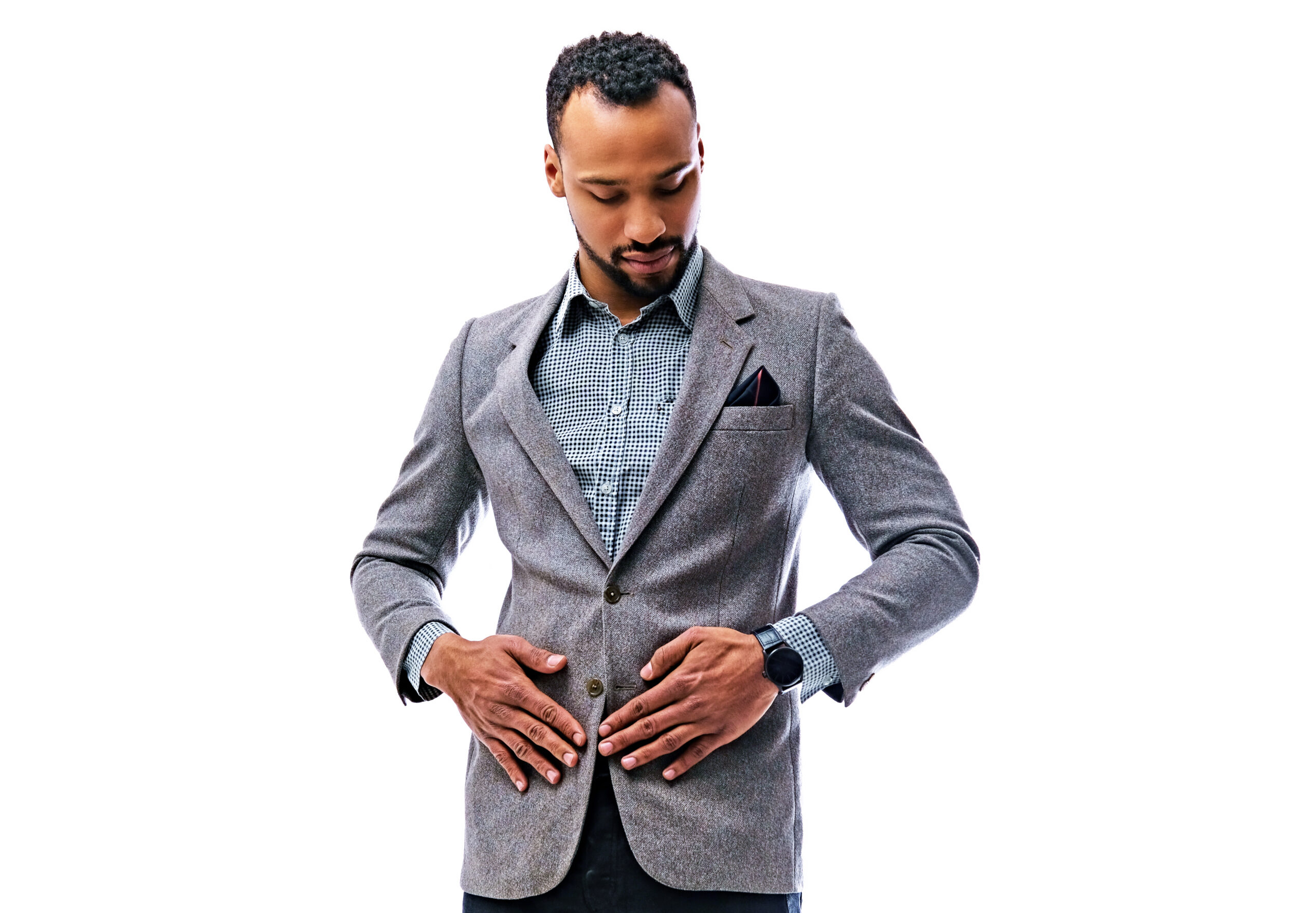 An elegant black male dressed in a suit isolated on white background.