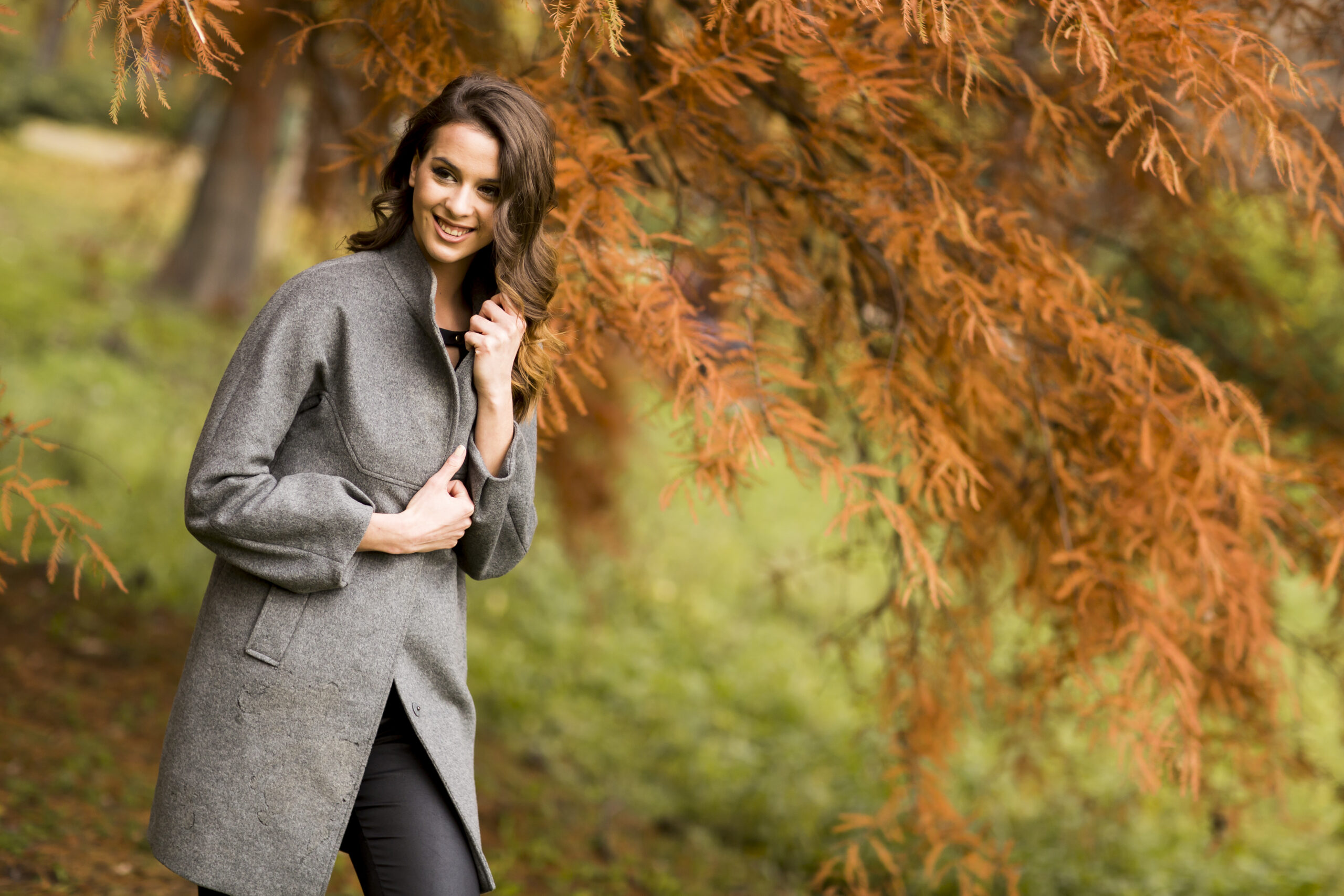 Pretty young woman in the autumn park